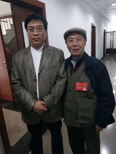 与中国文联志愿者协会副主席张继合影.jpg