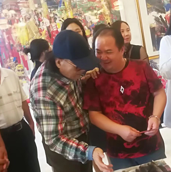 社会活动2 中国著名画家石齐先生给徐兵指导作品.jpg